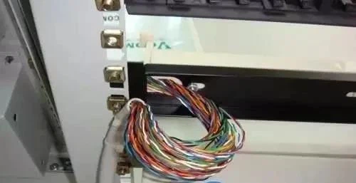 Secure the cables with cable ties, pass the cables through the entry holes on one side of the 110 voice patch panel, and arrange them at the punch-down area of the patch panel Secure the cables with cable ties, pass the cables through the entry holes on one side of the 110 voice patch panel, and arrange them at the punch-down area of the patch panel